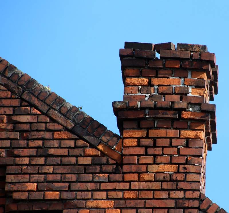 Damaged chimney on an Valley Village home showing cracks and missing mortar